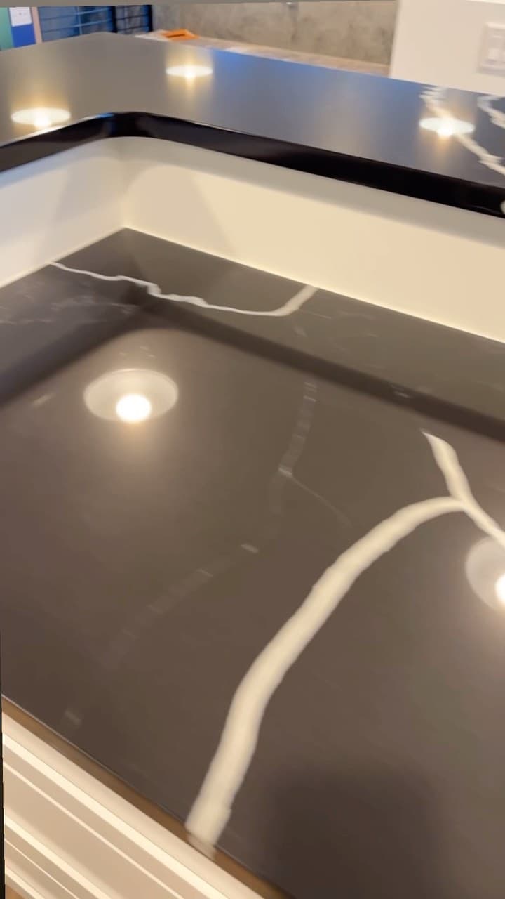 Black stone with a white lightning vein, close up